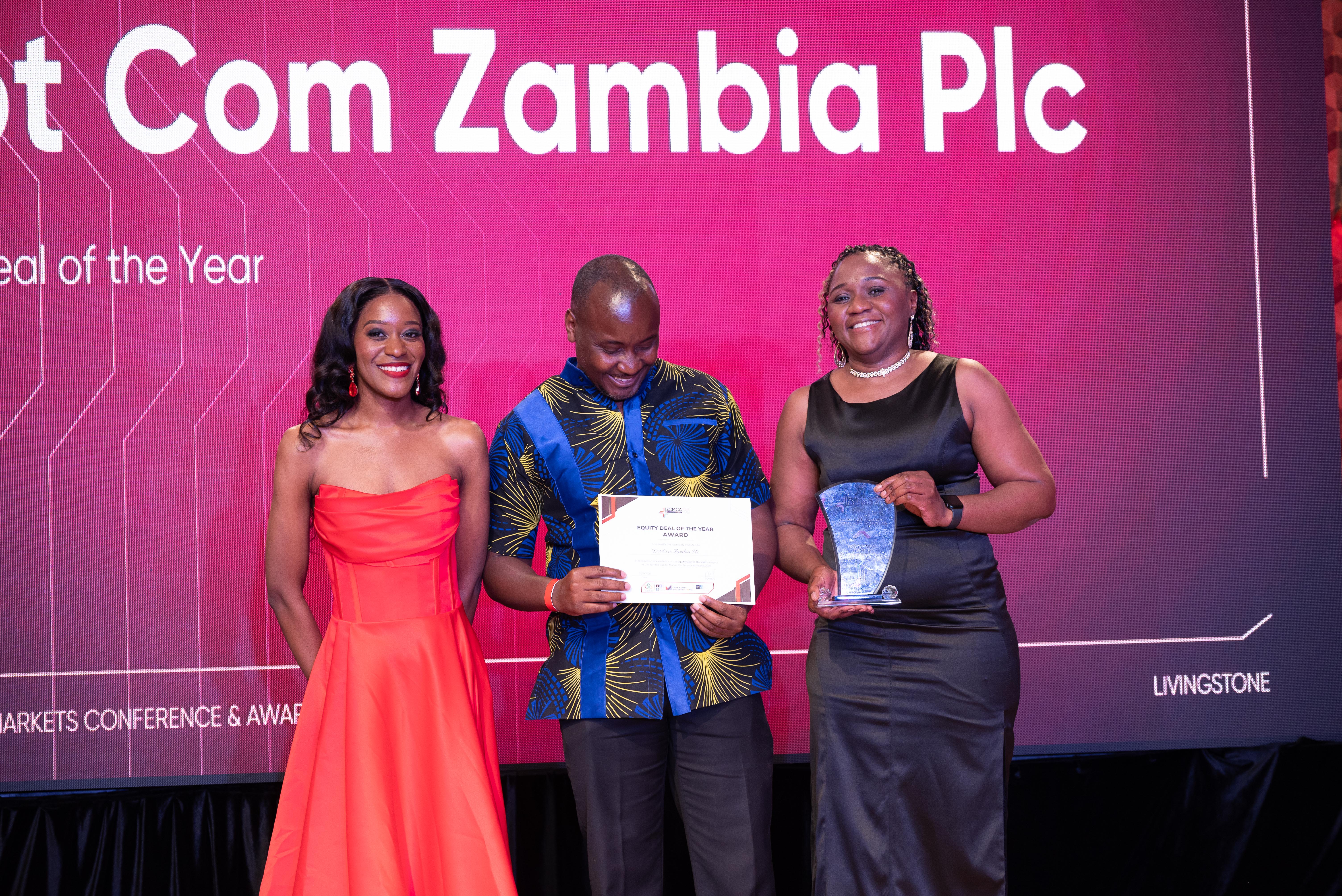 Dot Com Zambia PLC representatives holding the Equity Deal of the Year award