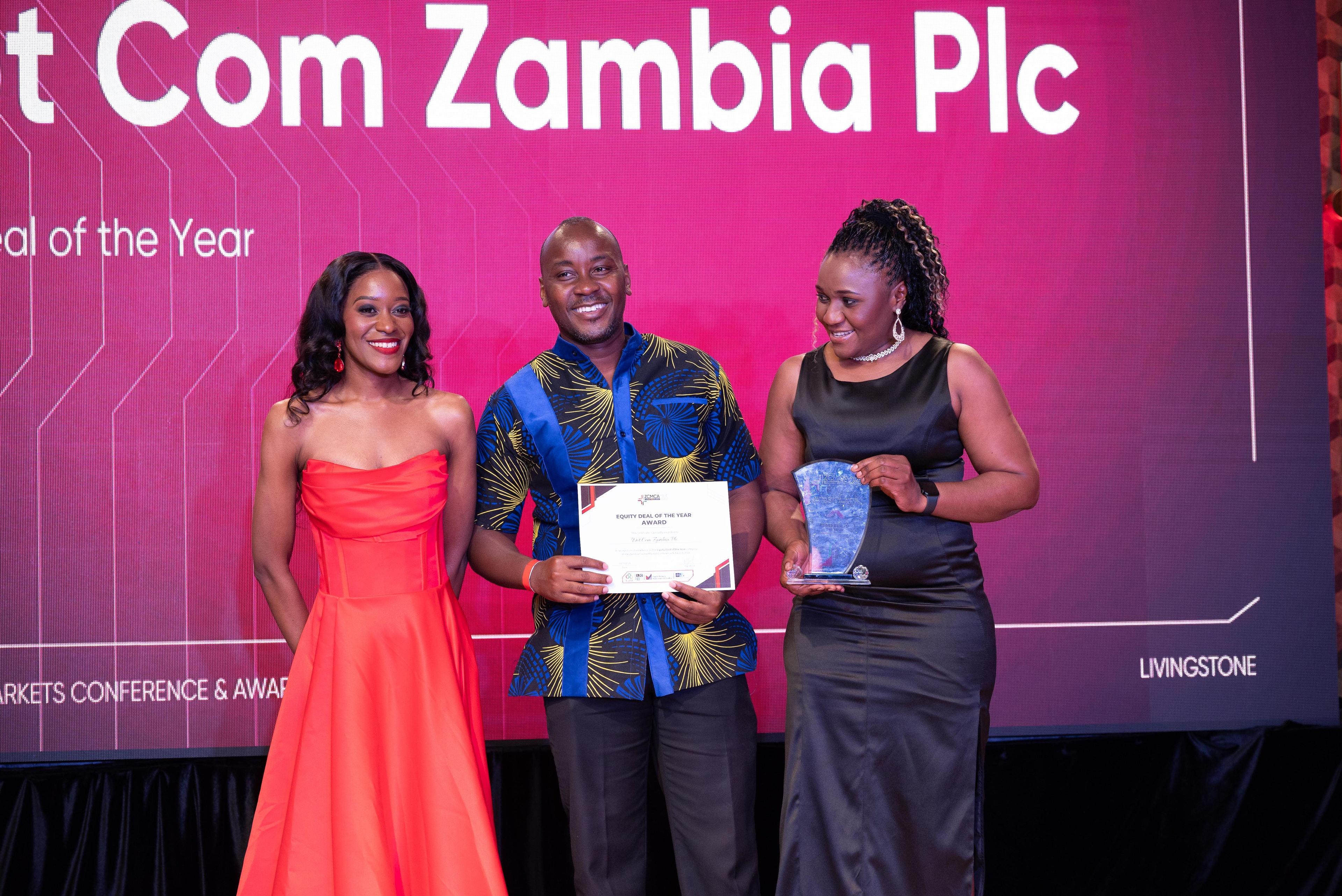 Dot Com Zambia PLC representatives with the award and certificate