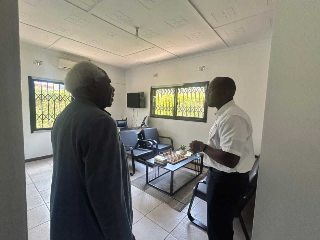Ambassador Mumba Kapumpa in conversation with Mawano Kambeu in the Dot Com Zambia offices